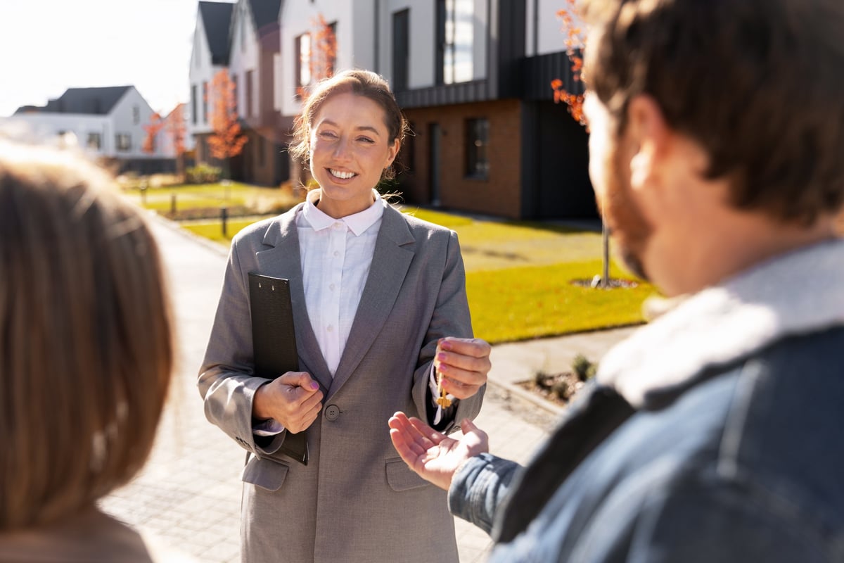 A homeowner receiving the keys to their property during a real estate handover
